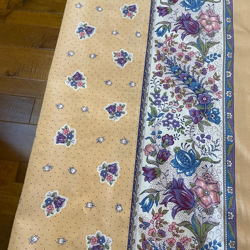 Pretty French tablecloth in pastel peach, blue, and white floral pattern